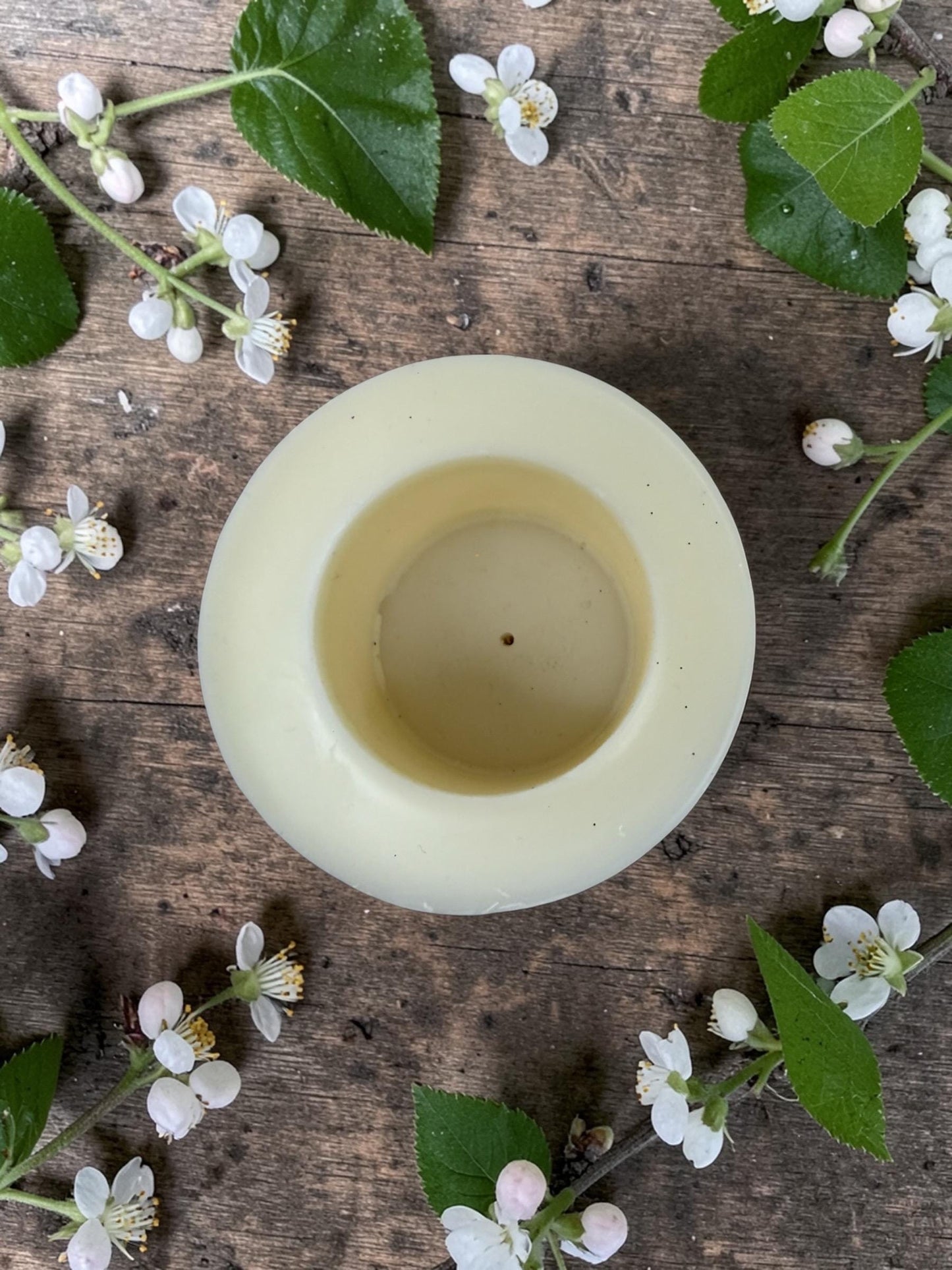 Reusable 4.5" Botanical Spring Candle in shades of purple, pink, yellow and green.