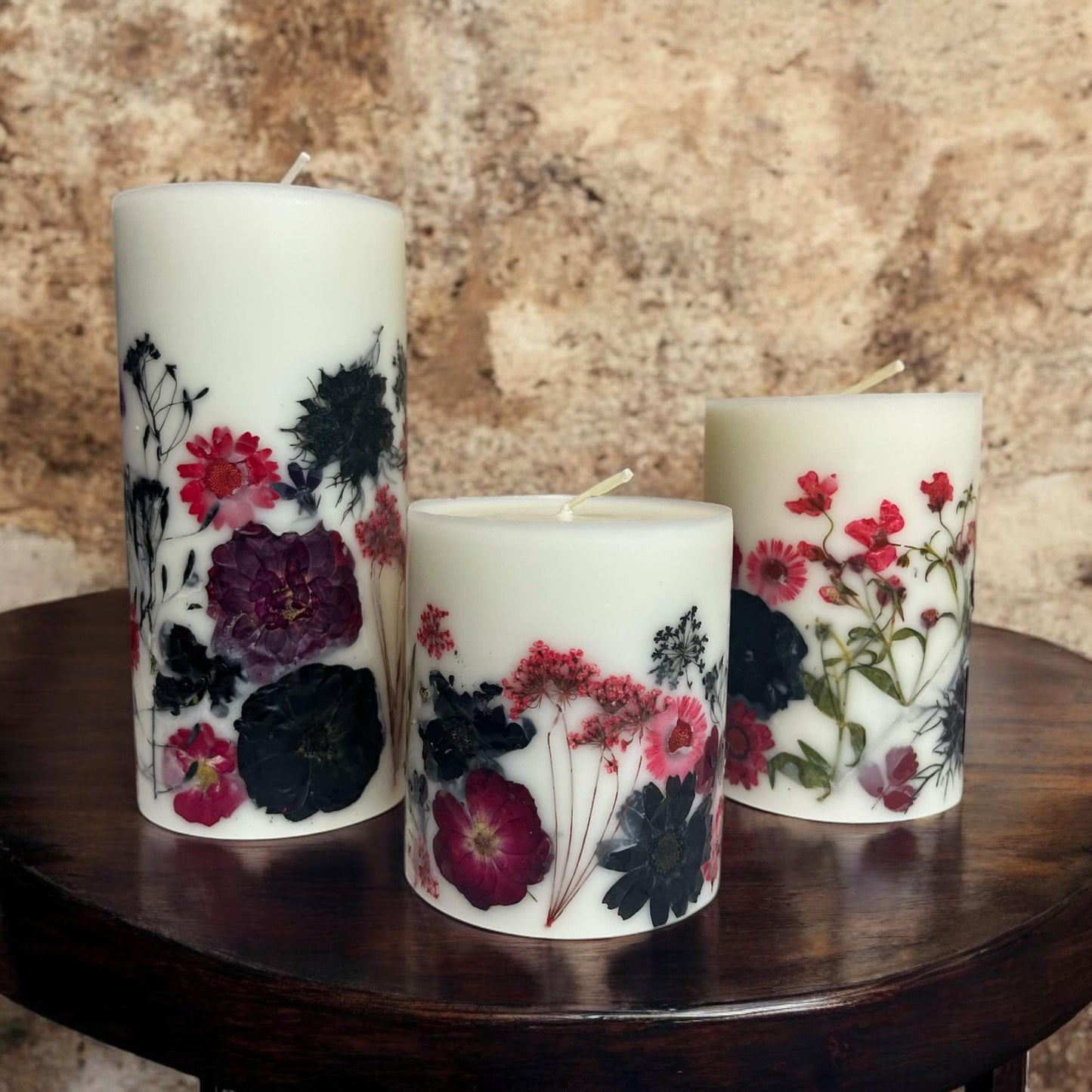 Pressed Flower Pillar Candle: Red & Black Botanical Design.
