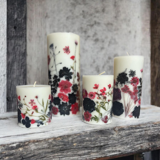 Pressed Flower Pillar Candle: Red & Black Botanical Design.