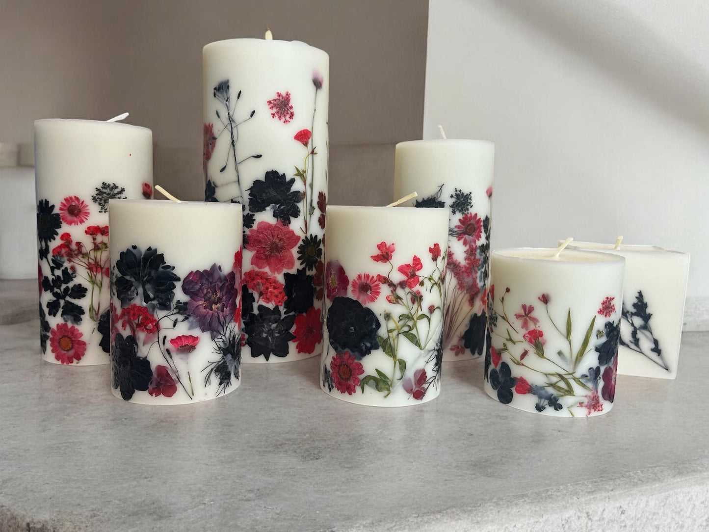 Pressed Flower Pillar Candle: Red & Black Botanical Design.