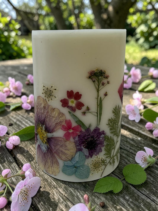 Reusable 4.5"  Botanical Spring Candle in shades of  purple, pink, yellow and green.