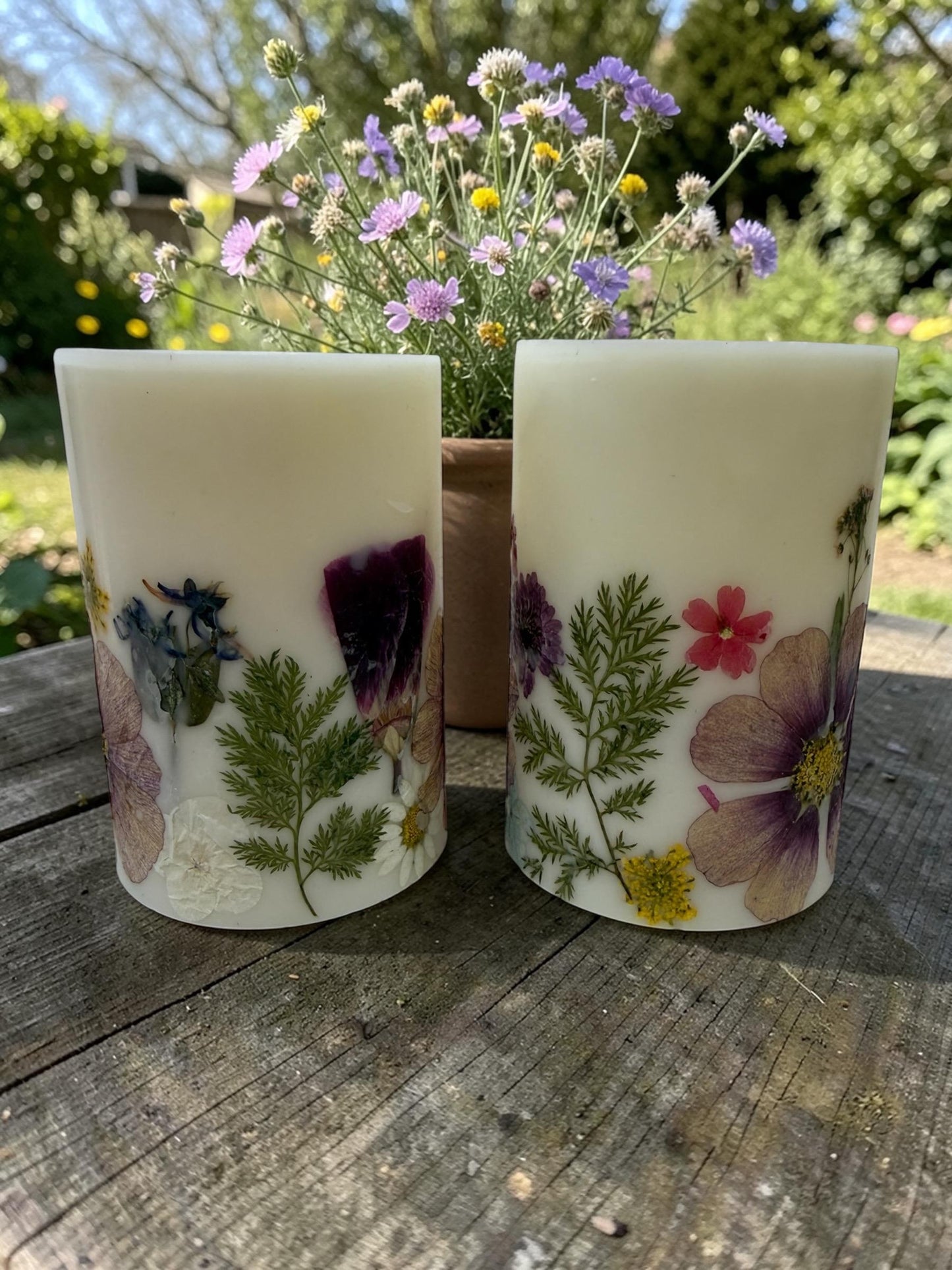 Reusable 4.5"  Botanical Spring Candle in shades of  purple, pink, yellow and green.