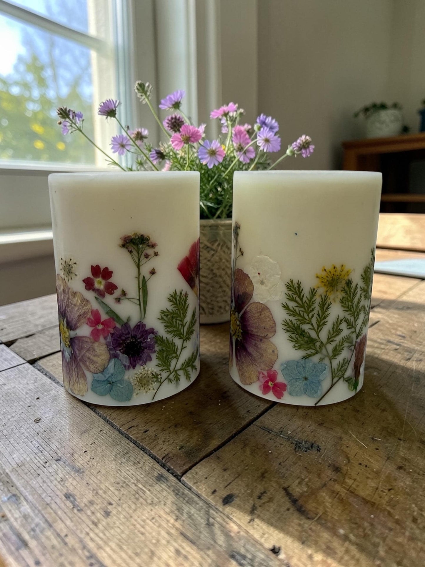 Reusable 4.5"  Botanical Spring Candle in shades of  purple, pink, yellow and green.