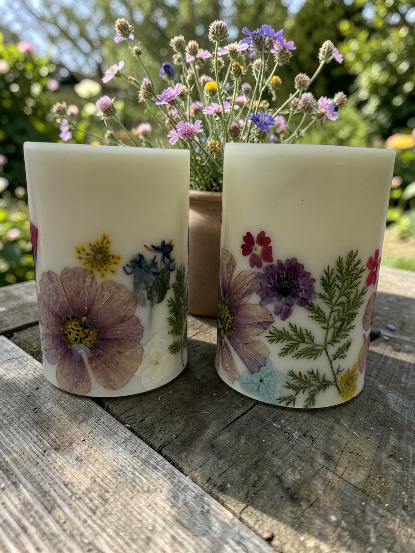 Reusable 4.5"  Botanical Spring Candle in shades of  purple, pink, yellow and green.