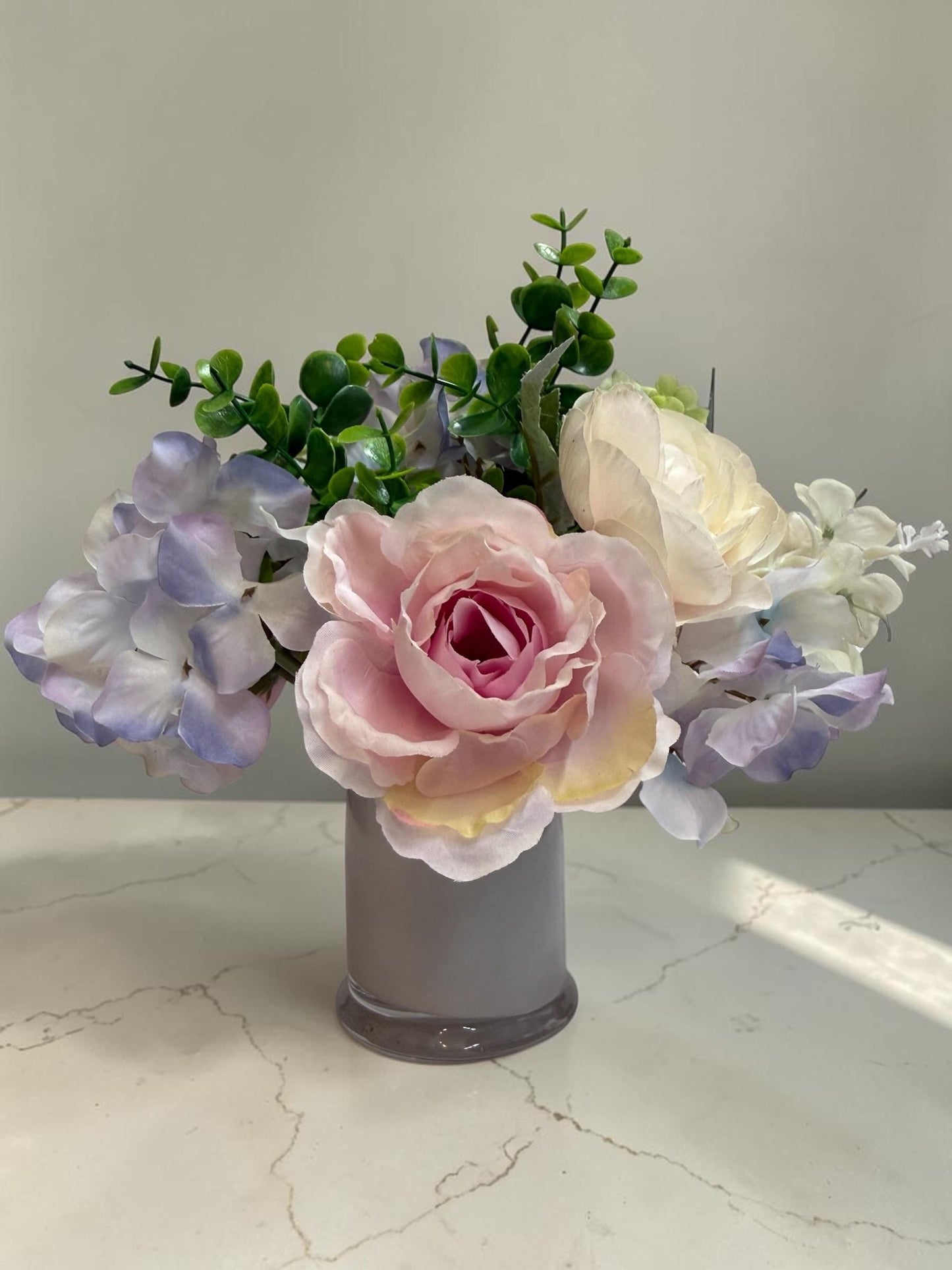 Faux Floral Arrangement in Gray Glass Jar, Pink, Purple, Blue and White Silk Roses and Hydrangeas, 10 inch x 11 Inch
